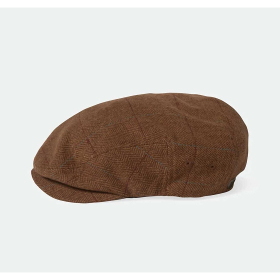 casquette plate Brixton en marron et beige, avec ses lignes bleues et rouges